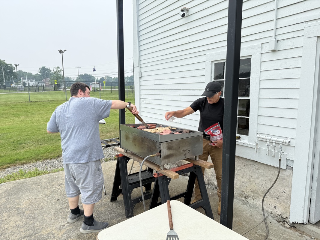 Brothers Robert Dean III and Marcelo Rosado manning the grill