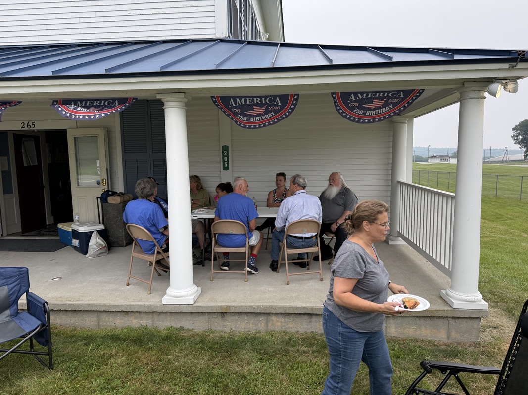 Brothers, friends, and family enjoying food and fellowship