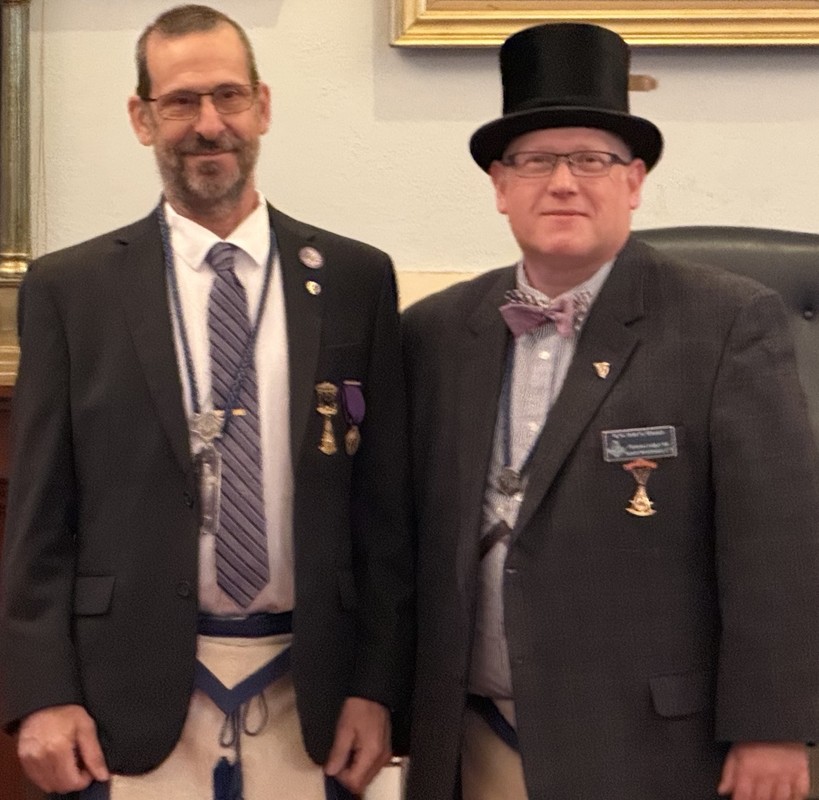 RW Richard S. Bruyere receiving his 15 year service award pin from WM John S. Rhoads